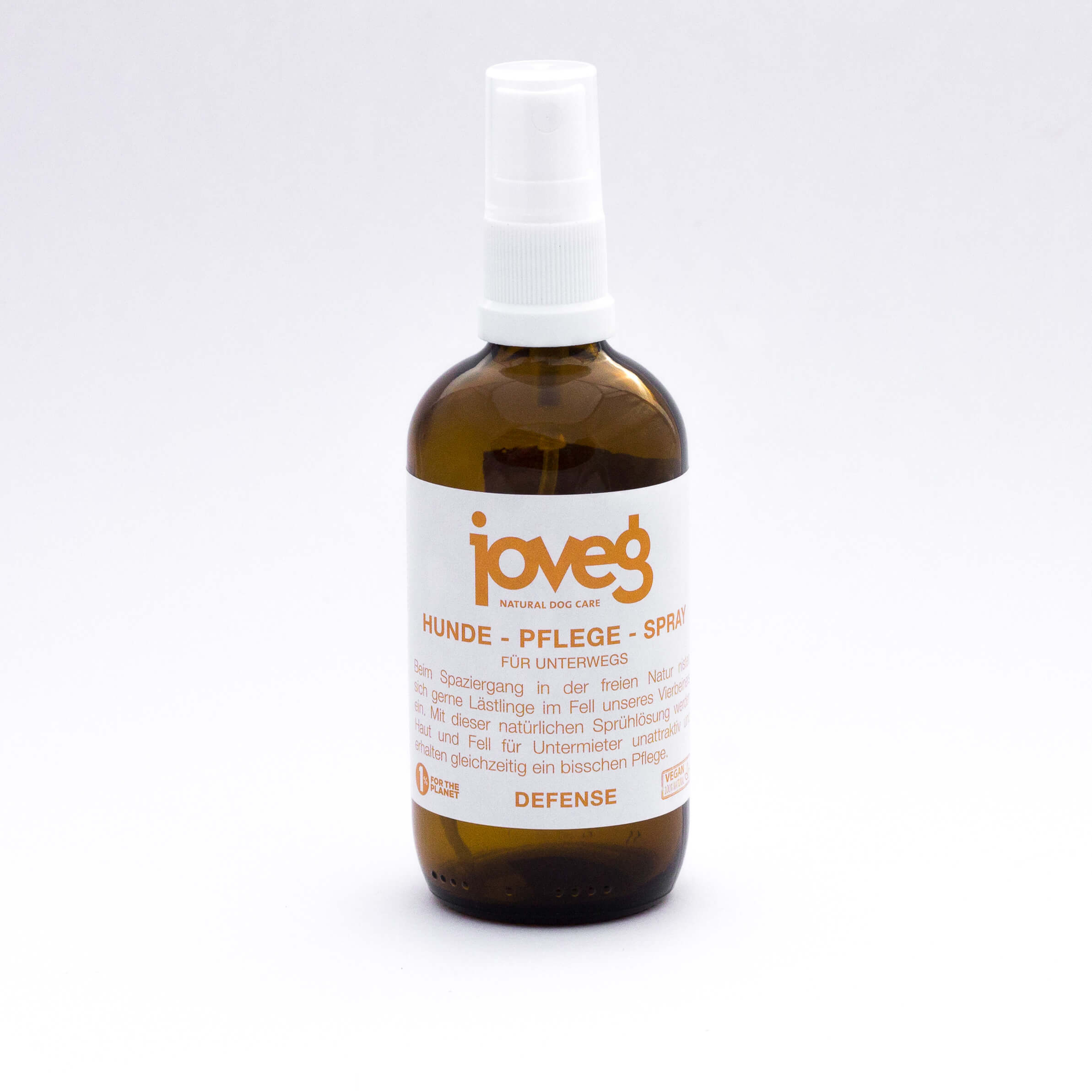 Braune Glasflasche mit weißem Etikett, Hunde Pflege Spray joveg